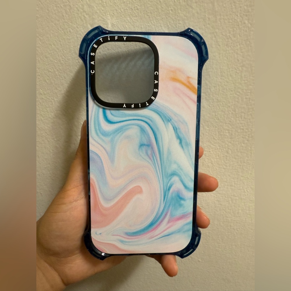 Casetify iPhone 16 pro bounce case with baby blue and pink marble design